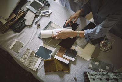 High angle view of female designers working at table in home office