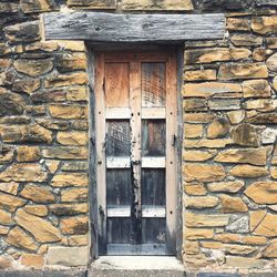 Brick wall with closed door