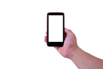 Low section of person holding smart phone against white background