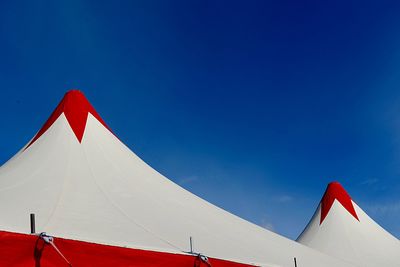 Low angle view of tent against clear blue sky