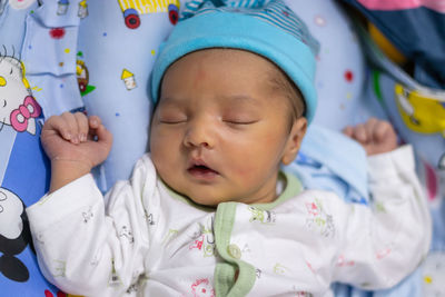 Newborn baby isolated sleeping in white cloth from different angle