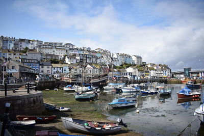 Boats moored at harbor