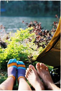 Low section of woman legs in water