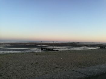 Scenic view of beach against clear sky