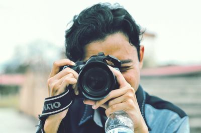 Portrait of man photographing