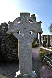 Low angle view of cross against the sky