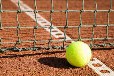 Close-up of tennis ball on field