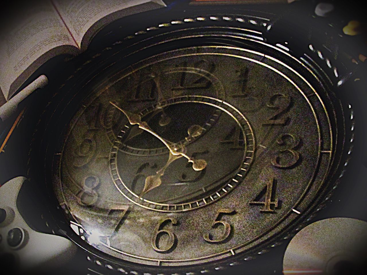 CLOSE-UP OF CLOCK ON METAL