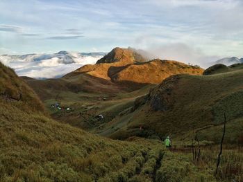 Scenic view of landscape and mountains against sky