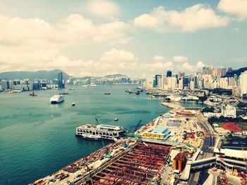 High angle view of harbor by sea against sky