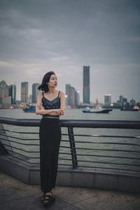 Full length of woman standing in city