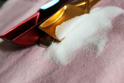 Close-up of salt spilled on table