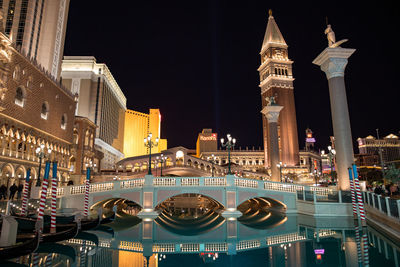 Illuminated buildings in city at night