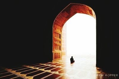 Silhouette of woman in corridor
