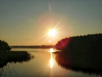 Scenic view of sunset over river