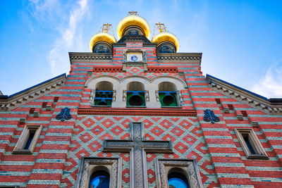 Low angle view of ornate building against sky