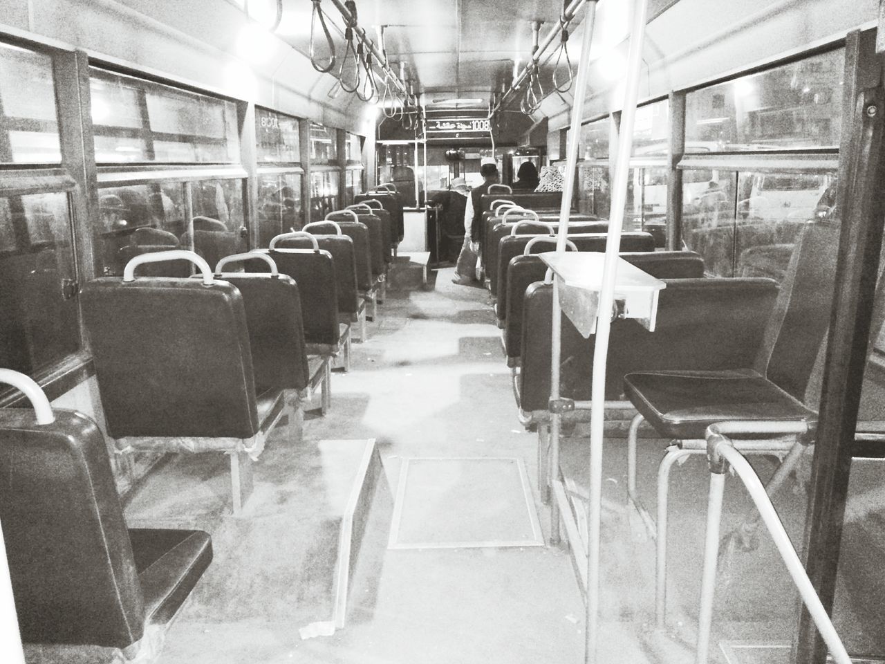 indoors, empty, interior, absence, chair, architecture, built structure, in a row, transportation, window, abandoned, the way forward, seat, ceiling, no people, vehicle seat, day, narrow, old, warehouse