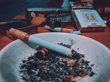 Close-up of cigarette on table