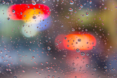 Close-up of raindrops on glass window