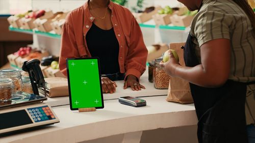 Midsection of man working at table