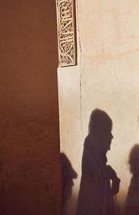 Shadow of people on wall