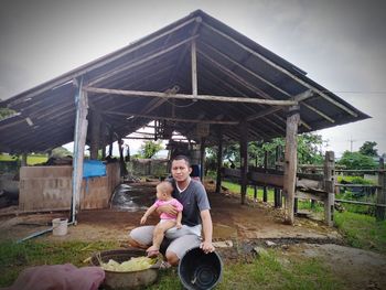 Portrait of couple sitting on land