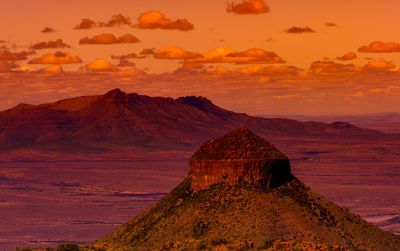 Scenic view of rock formation against sky during sunset