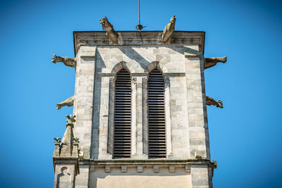 Low angle view of building against blue sky