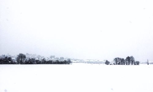 Scenic view of frozen lake against clear sky