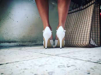 Low section of woman standing on floor