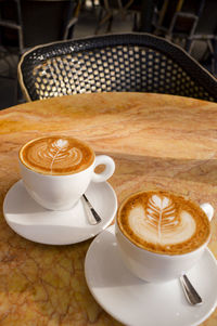 Close-up of cappuccino on table