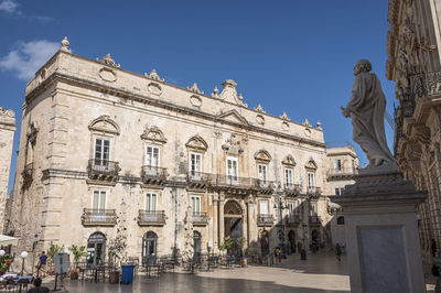 Historic buildings with beautiful facades in piazza duomo in ortigia