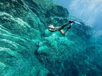 Girl swims underwater