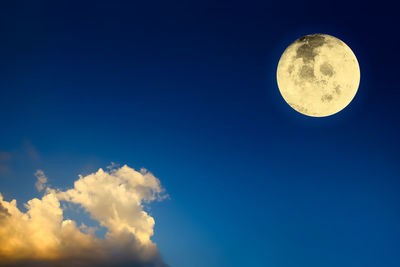 Low angle view of moon against sky at night