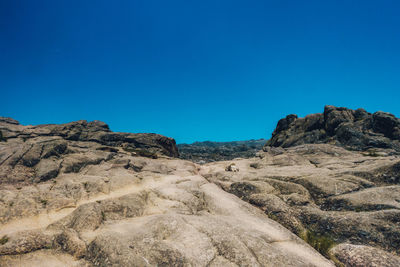 Scenic view of mountain against clear blue sky