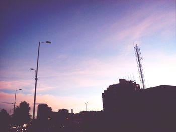 Low angle view of building against sky at sunset