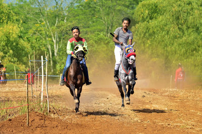 Woman riding horse running