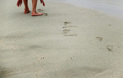 Low section of woman on beach