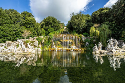 View of the fountain of diana and the great waterfall at the gardens of caserta royal palace