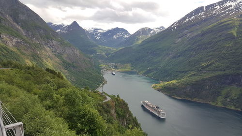 Scenic view of geirangerfjord amidst mountains