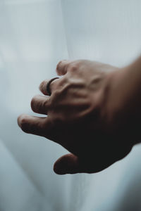 Close-up of hands against blurred background