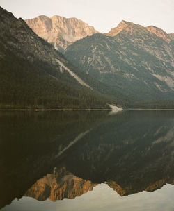 Scenic view of lake and mountains against sky at plansee in austria. shot on kodak portra 400 film