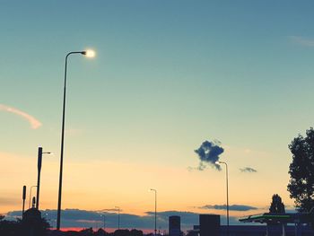 View of illuminated street lights at night