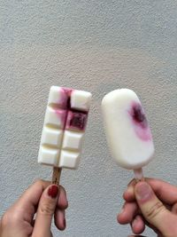 Close-up of hand holding ice cream cone