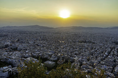 Aerial view of townscape against sky during sunset