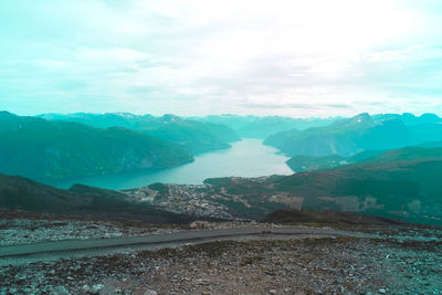 Scenic view of landscape and mountains against sky