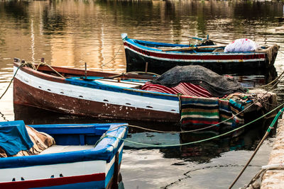 Fishing boats moored in lake