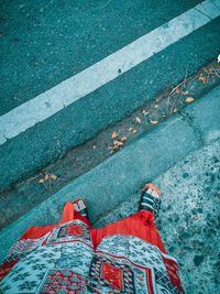 Low section of person standing on street