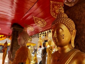 Statues in temple outside building