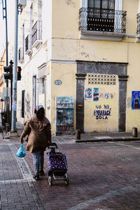 Homeless woman walks down the street